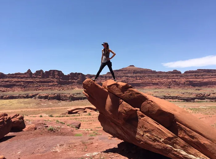 Kaylee Stepkoski posing ontop of a rock